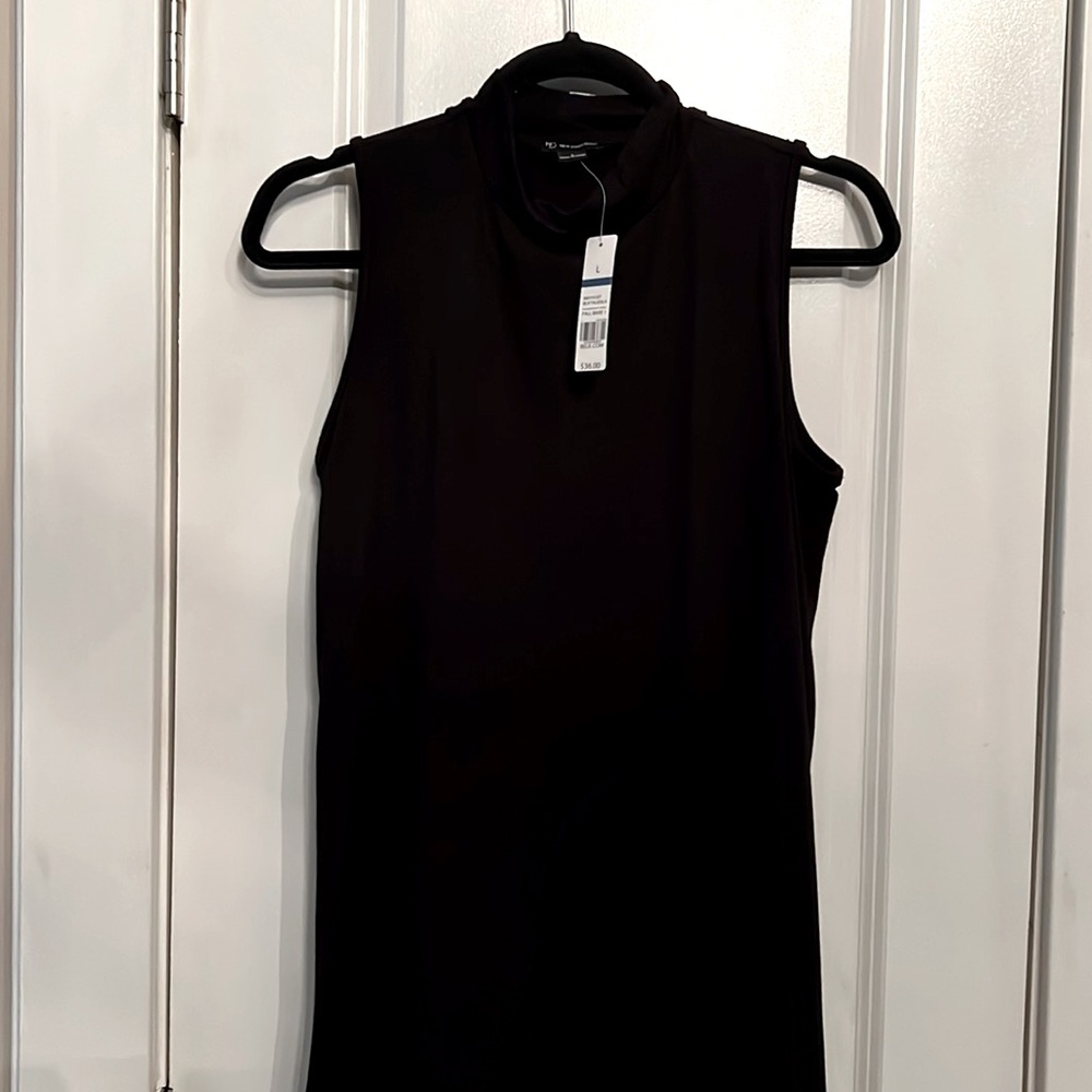 Mock turtle neck sleeveless black tee.never worn with tags